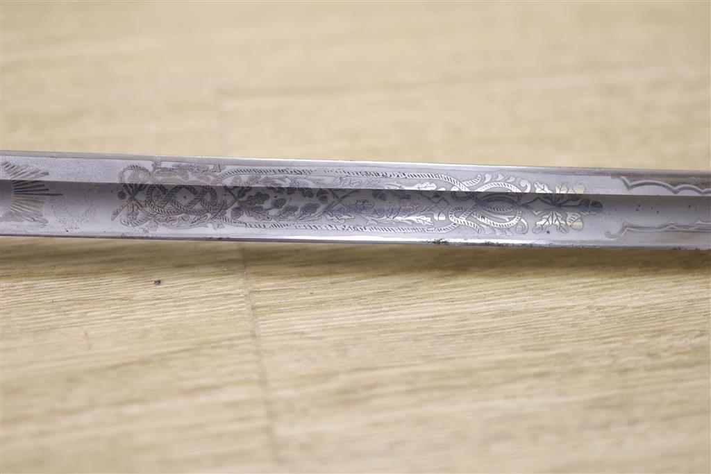 A George V Naval officers sword, by J R Gaunt & Son, Serial No. 16427 together with scabbard and leather case